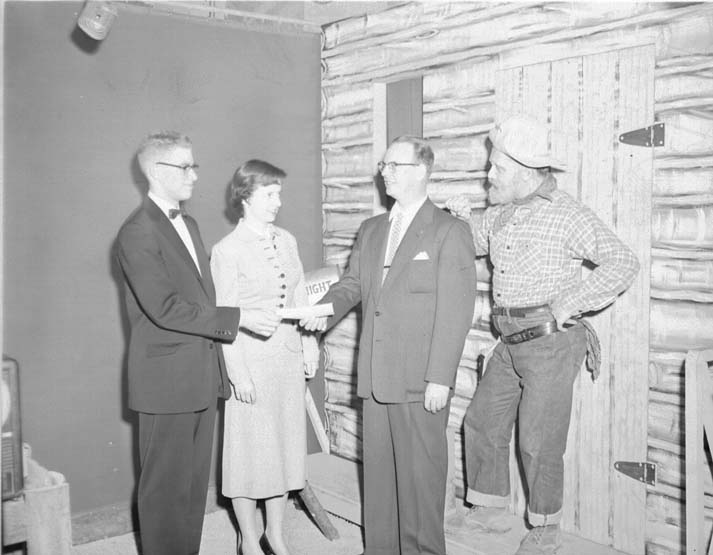A second view of the same studio presentation, with Windy Knight looking on.